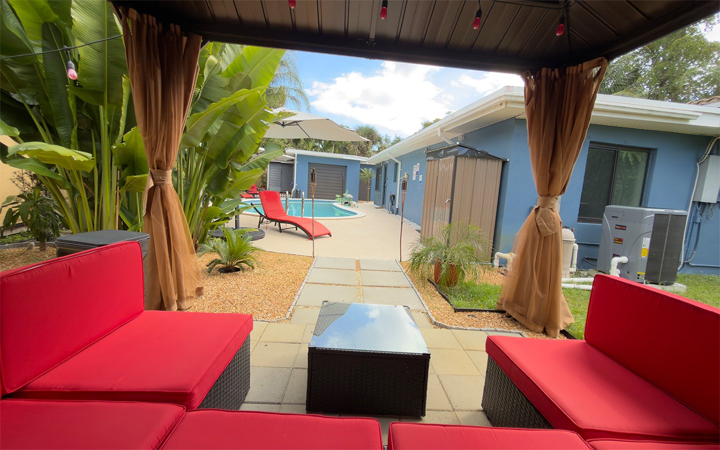 Relaxed outdoor seating at Garden of Manors, designed for social moments with easy access to the pool.